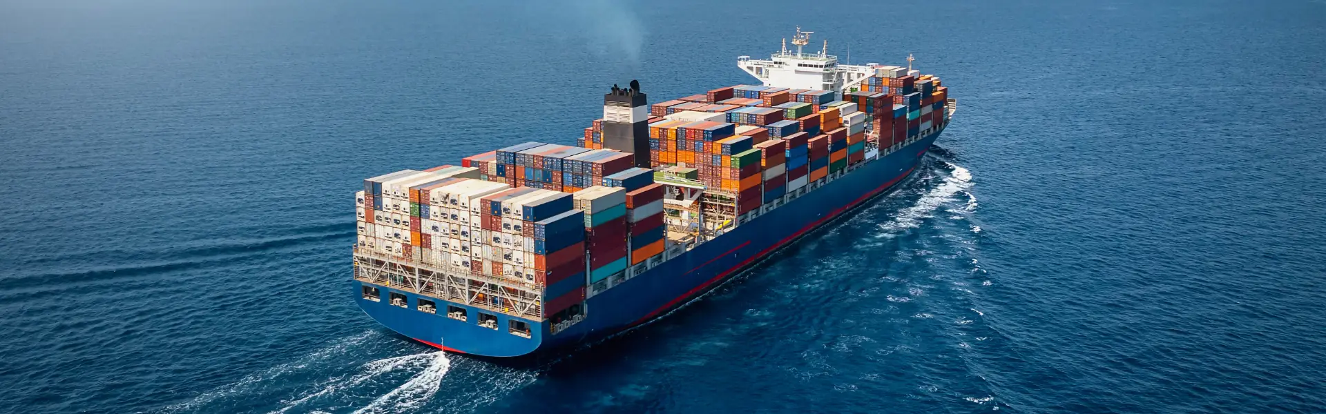 A container ship carrying export cargo at sea